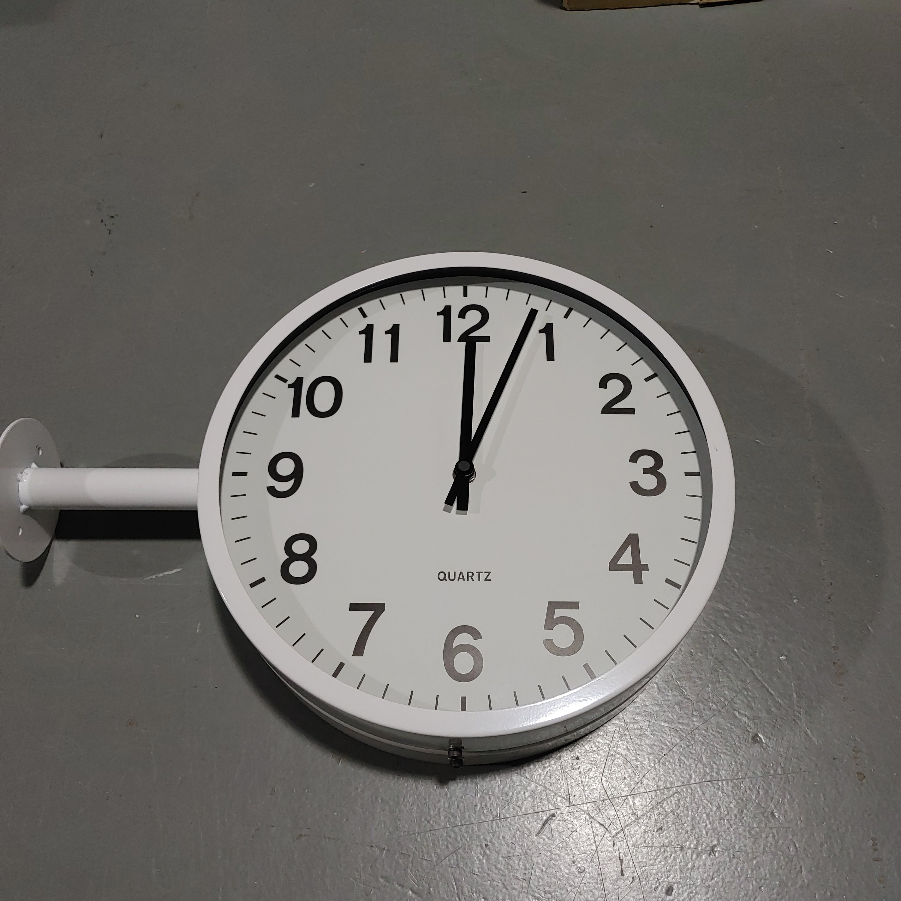 Double sided wall clock